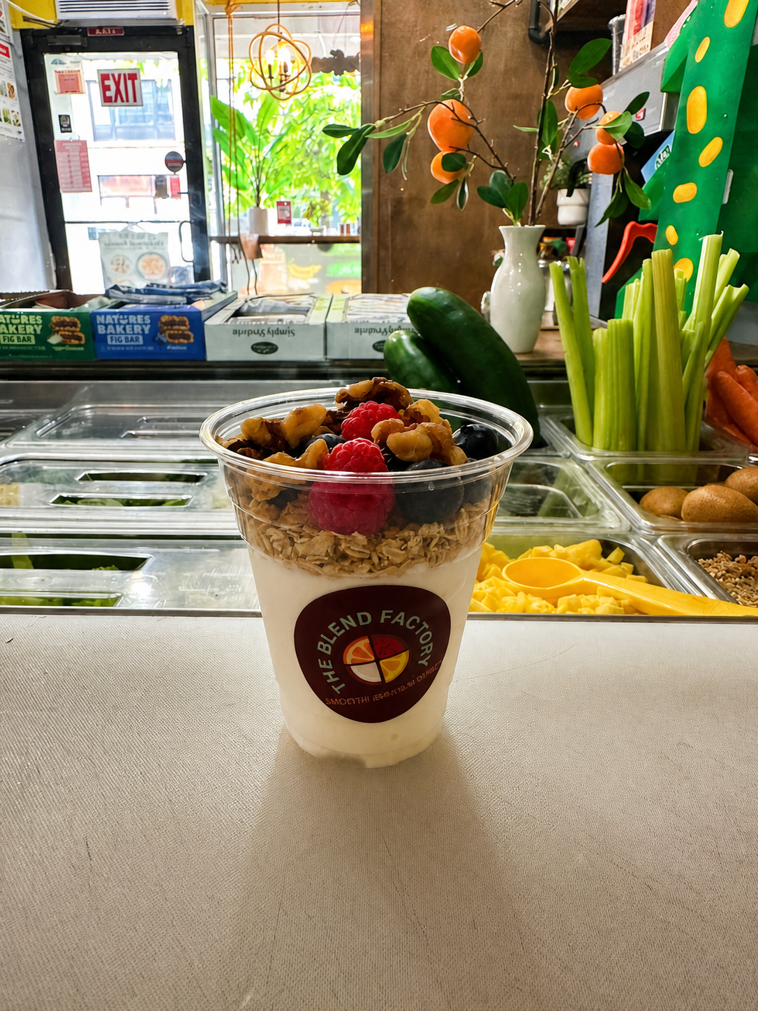 Fruit and granola parfait cup prepared at The Blend Factory counter