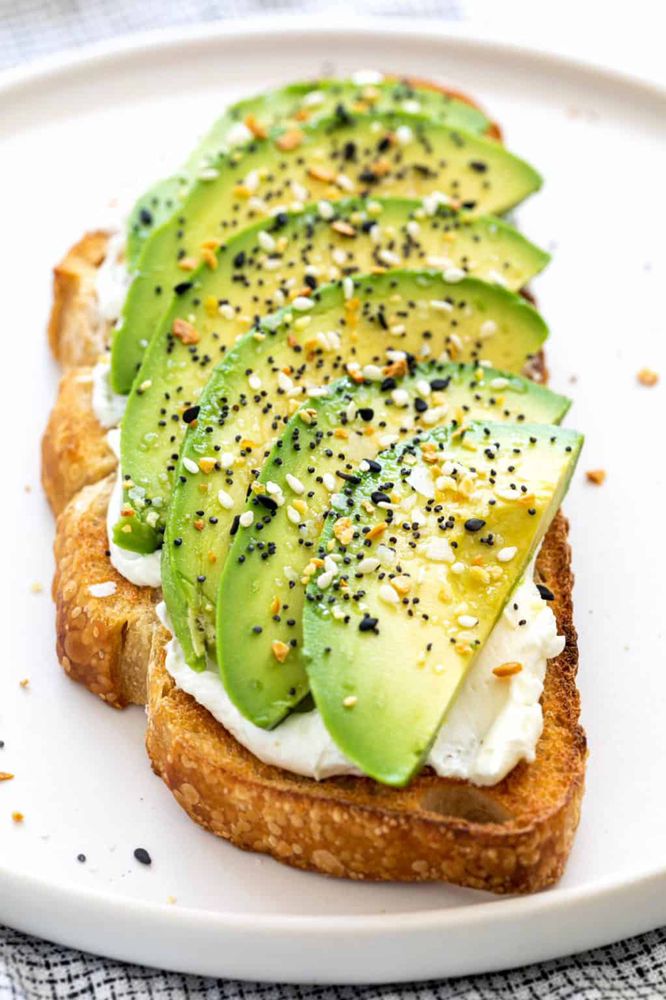 Avocado toast layered with sliced avocado and everything seasoning